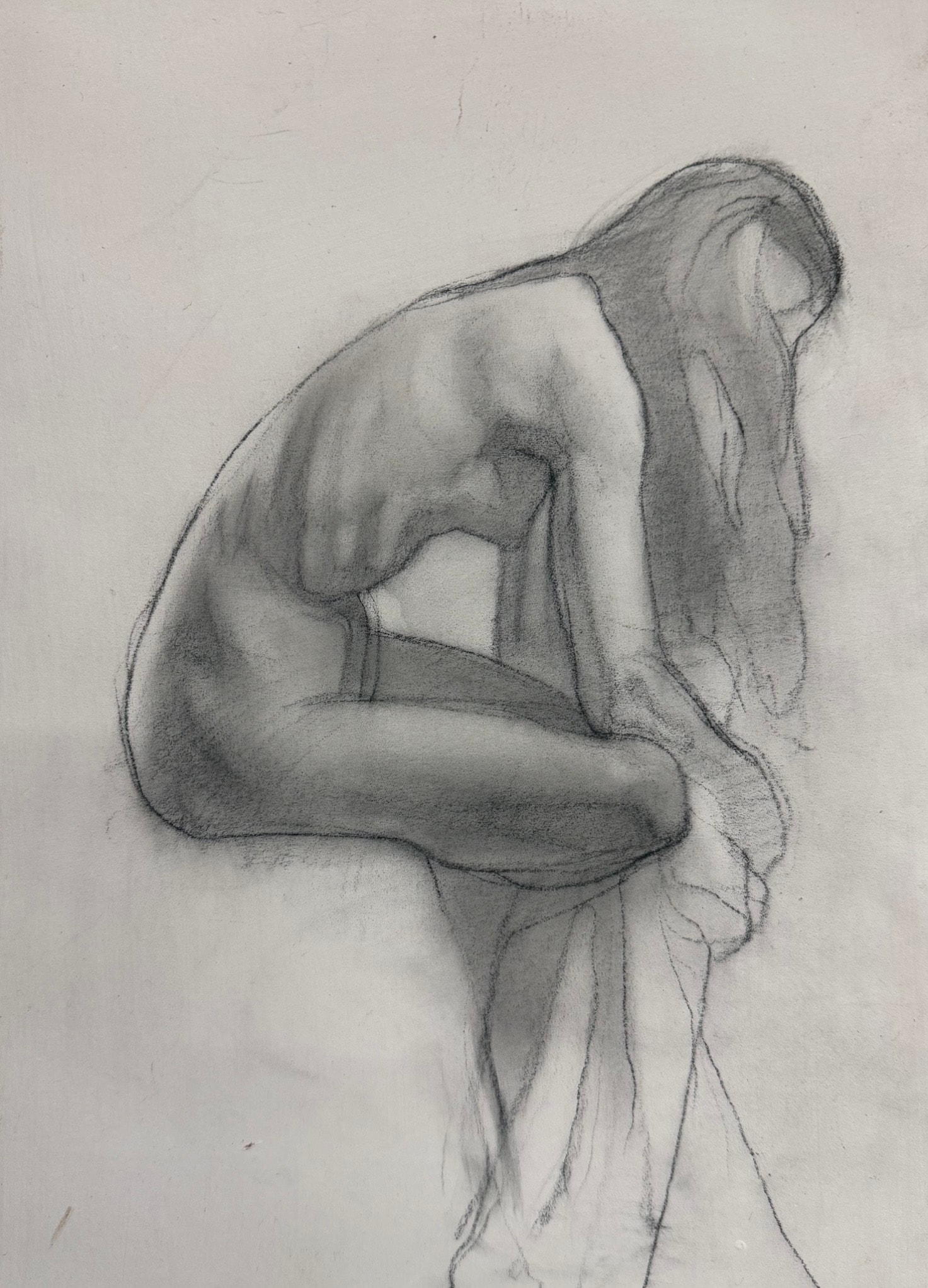 Seated figure, charcoal on paper